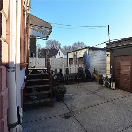Image 3 - 78-34 73rd Place, New York, NY 11385, USA - House for sale