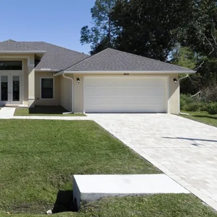 Buy this 3 bed house on 3143 Southwest McMullen Street in Port Saint Lucie, FL 34953