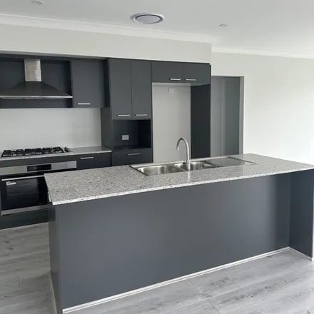 Rent this 4 bed apartment on Pankhurst Avenue in Dillans Scrub NSW 2334, Australia
