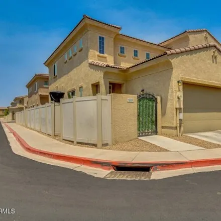 Rent this 3 bed townhouse on West Altana Avenue in Mesa, AZ 85210