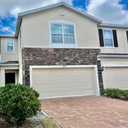 Rent this 4 bed townhouse on unnamed road in Buenaventura Lakes, FL 34744