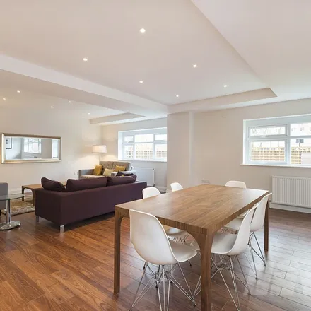 Rent this 4 bed townhouse on Tesco Express in 47, 49 Belsize Road