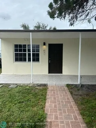 Rent this 2 bed house on 831 East 16th Place in Sun-Tan Village, Hialeah