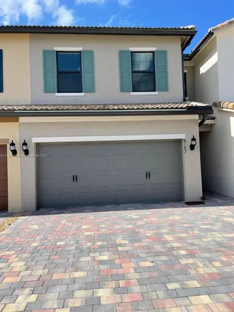 Rent this 3 bed townhouse on 8008 Marshwood Lane in Palm Beach County, FL 33467
