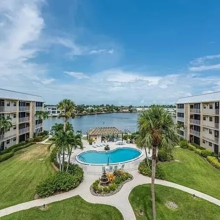 Buy this 2 bed condo on Harbour Cove in Gulf Shore Boulevard North, Naples
