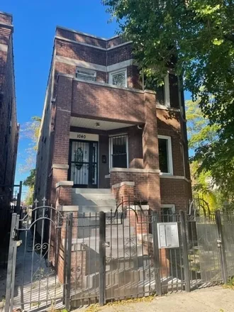 Rent this 2 bed house on 1040 North Springfield Avenue in Chicago, IL 60651