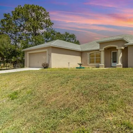 Buy this 4 bed house on 701 Furth Road Northwest in Palm Bay, FL 32907
