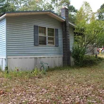 Buy this studio apartment on 298 Hibiscus Hill Drive in Oak Hill, Henderson County