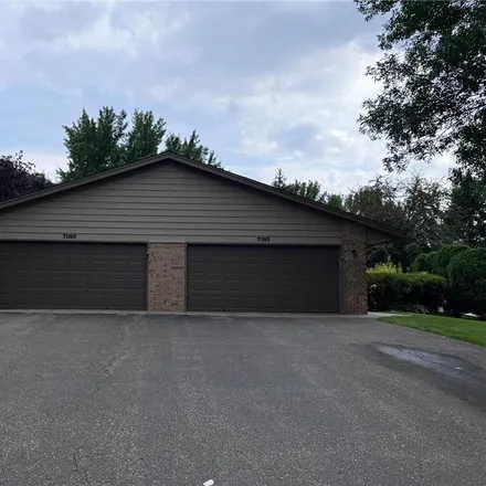 Buy this 3 bed townhouse on 7093 Robinwood Trail in Woodbury, MN 55125