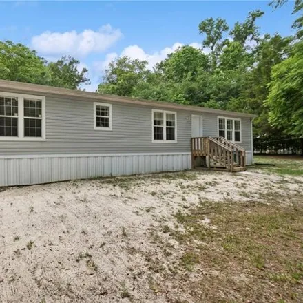 Buy this studio apartment on 222 Southwest Turtle Place in Columbia County, FL 32038