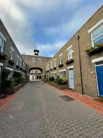 Buy this 3 bed townhouse on Clock Tower Mews in London, N1 7BB