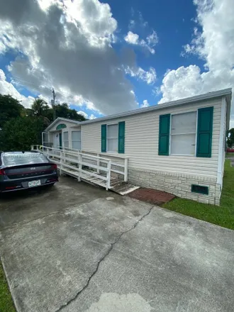 Buy this 4 bed house on 220 Northeast 12th Avenue in Four Seasons Mobile Home Park, Homestead