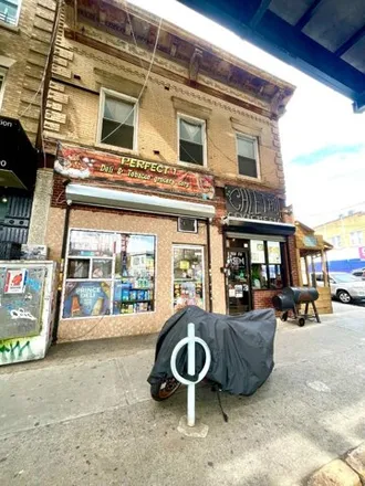 Buy this 3 bed house on 111-23 Jamaica Avenue in New York, NY 11418