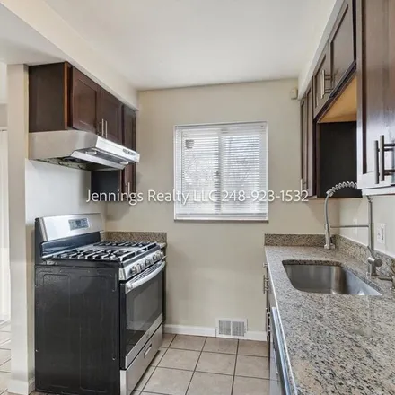 Rent this 4 bed apartment on 21874 Avon Road in Oak Park, MI 48237