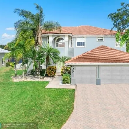 Buy this 5 bed house on 5125 Nw 123rd Ave in Coral Springs, Florida