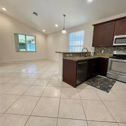 Rent this 4 bed apartment on 6802 Northwest 81st Court in Parkland, FL 33067