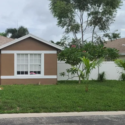 Buy this 3 bed house on 1787 Sawgrass Circle in Greenacres, FL 33413