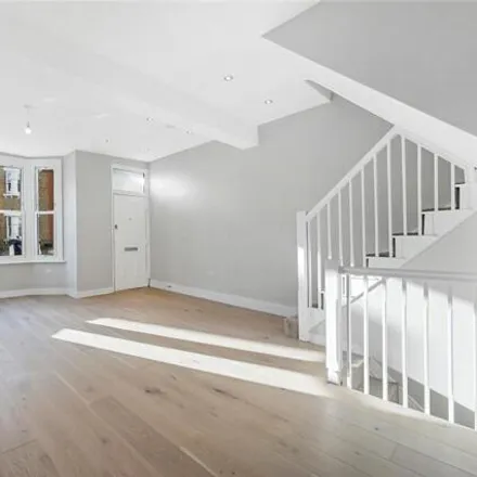 Rent this 4 bed townhouse on John Burns Primary School in 21 Wycliffe Road, London