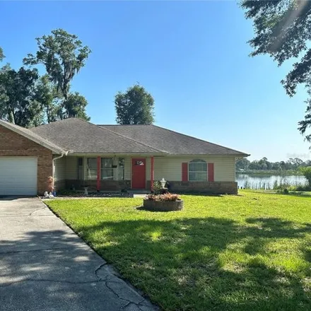 Rent this 3 bed house on 1271 North Village Lake Drive in DeLand, FL 32724