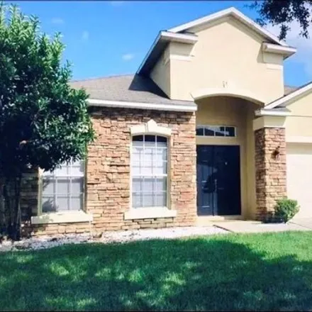 Rent this 4 bed house on 13653 Tetherline Trail in Orange County, FL 32837