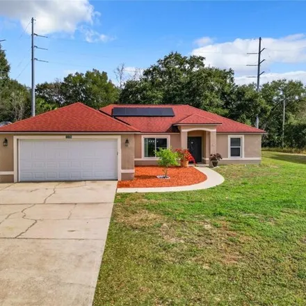 Buy this 4 bed house on 1105 Windy Bluff Drive in Minneola, FL 34715