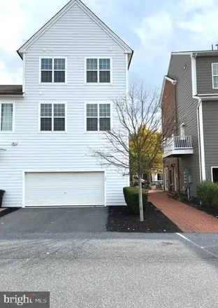 Rent this 3 bed townhouse on Silver Spring Commons in GameStop, Sporting Green Drive