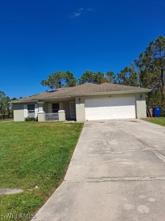 Rent this 3 bed house on 431 Broadmoor Street in Lehigh Acres, FL 33974
