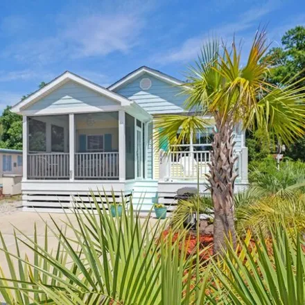 Buy this 4 bed house on 122 NE 72nd St in Oak Island, North Carolina