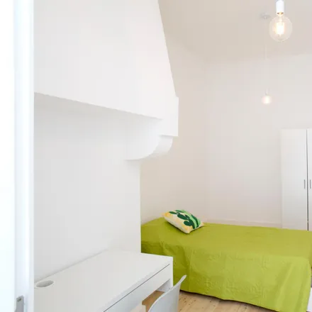 Rent this 4 bed room on Avenida Manuel da Maia 13 in 1000-046 Lisbon, Portugal
