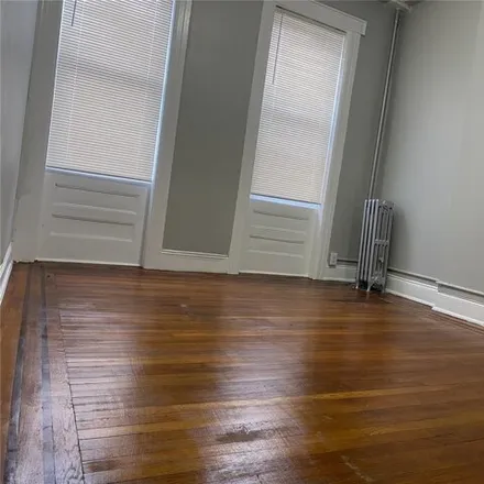 Rent this 3 bed house on 89-16 Jamaica Avenue in New York, NY 11421