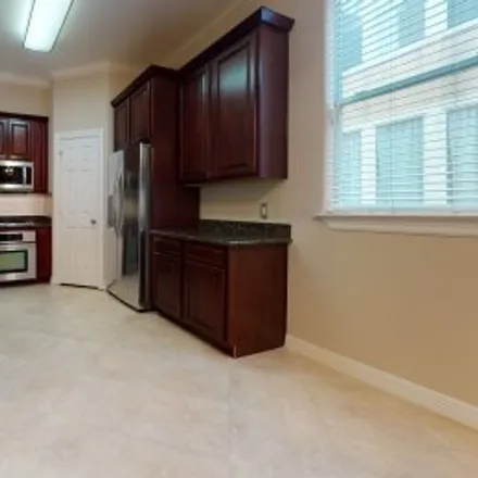 Rent this 3 bed apartment on 3008 Chenevert Street in Midtown, Houston