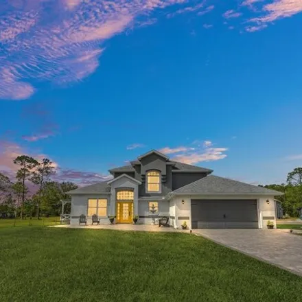 Buy this 5 bed house on 280 Spring Forest Drive in New Smyrna Beach, FL 32168
