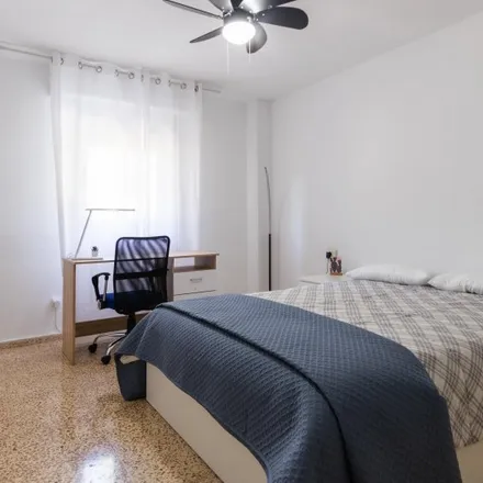 Rent this 4 bed room on Calle de Santísima Trinidad in 46100 Burjassot, Spain