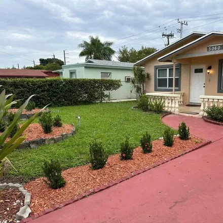 Rent this 3 bed house on 3074 Northwest 6th Court in Washington Park, Broward County