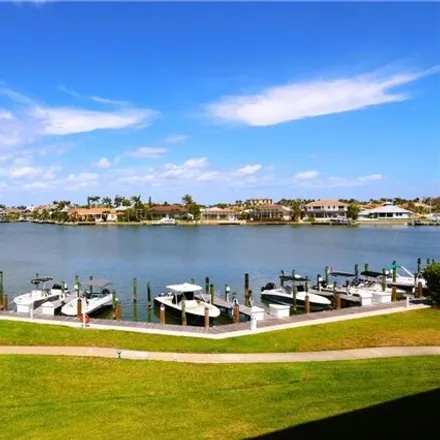 Buy this 2 bed condo on Bayside Court in Marco Island, FL 33937