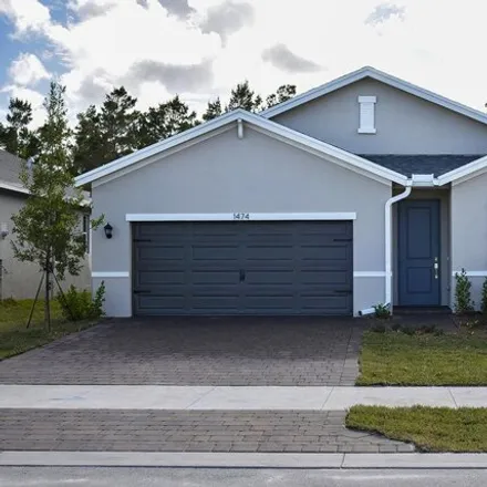 Rent this 4 bed house on Northeast White Pine Terrace in Ocean Breeze, Jensen Beach