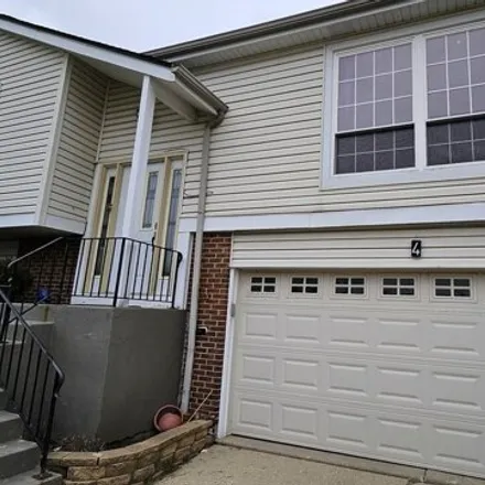 Rent this 4 bed house on 98 Warwick Court in Streamwood, IL 60107