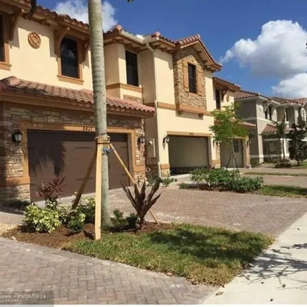 Rent this 4 bed house on 8435 Blue Cove Way Unit 8435 in Parkland, Florida