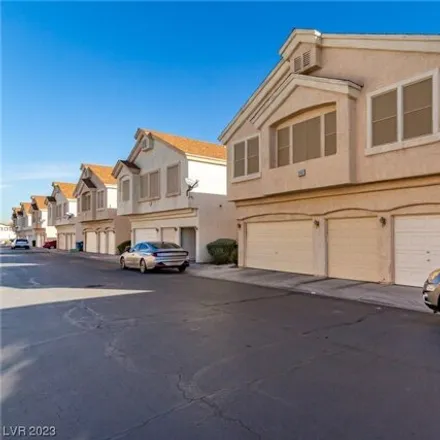 Buy this 3 bed townhouse on 5964 Trickling Descent Street in Clark County, NV 89011