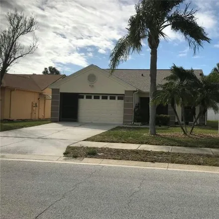 Rent this 3 bed house on 10447 Midstate Avenue in Bayonet Point, FL 34668