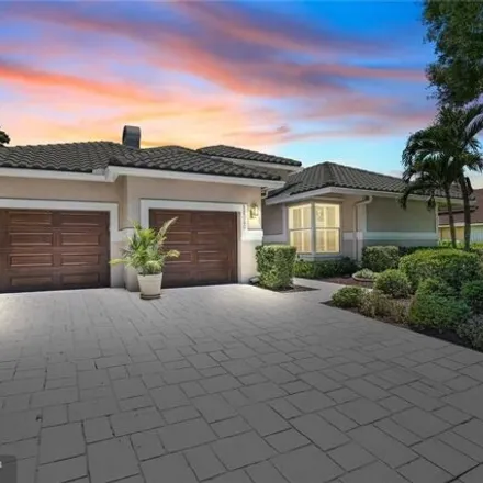 Buy this 4 bed house on Eagle Trace Golf Club in 1111 Eagle Trace Boulevard West, Coral Springs