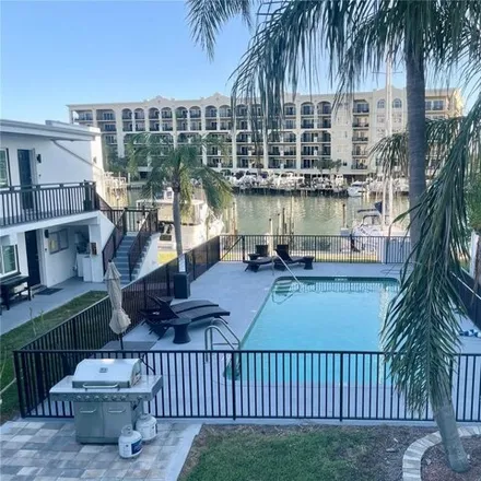 Rent this 2 bed apartment on 223 Dolphin Pt Apt 10 in Clearwater Beach, Florida