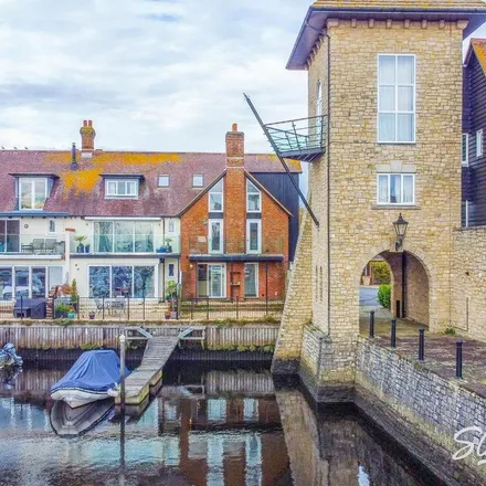 Rent this 3 bed townhouse on Rossiters Quay in Christchurch, BH23 1DJ