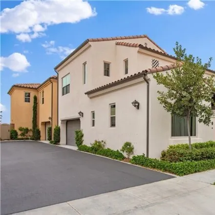 Rent this 4 bed condo on 102 Soaring Eagle in Irvine, CA 92618
