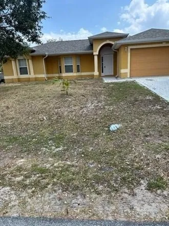 Rent this 3 bed house on 744 Starland Street Southeast in Palm Bay, FL 32909