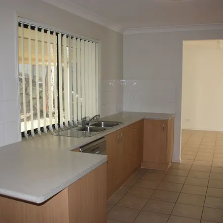 Rent this 4 bed apartment on Mungana Drive in Upper Coomera QLD 4209, Australia