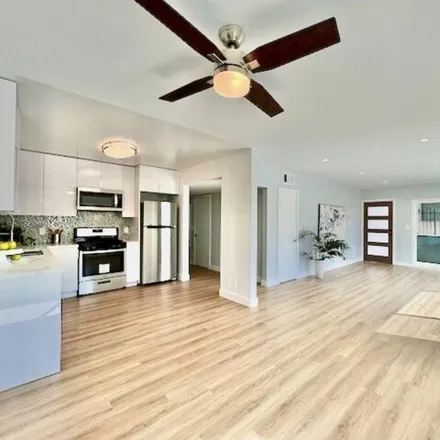 Rent this 3 bed apartment on 2012 S Bedford St Apt 1 in Los Angeles, California