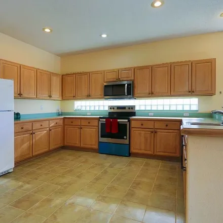 Rent this 4 bed apartment on 8550 Blue Horizon Court in Four Corners, FL 34747