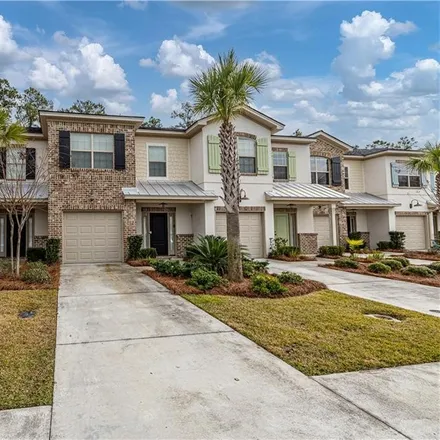 Rent this 3 bed townhouse on 298 Island Drive in Mallory Park, Saint Simons