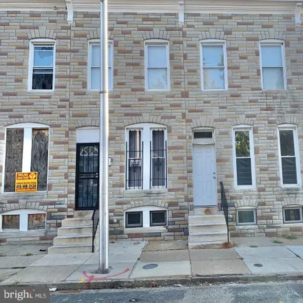 Buy this 4 bed townhouse on 1701 North Carey Street in Baltimore, MD 21217